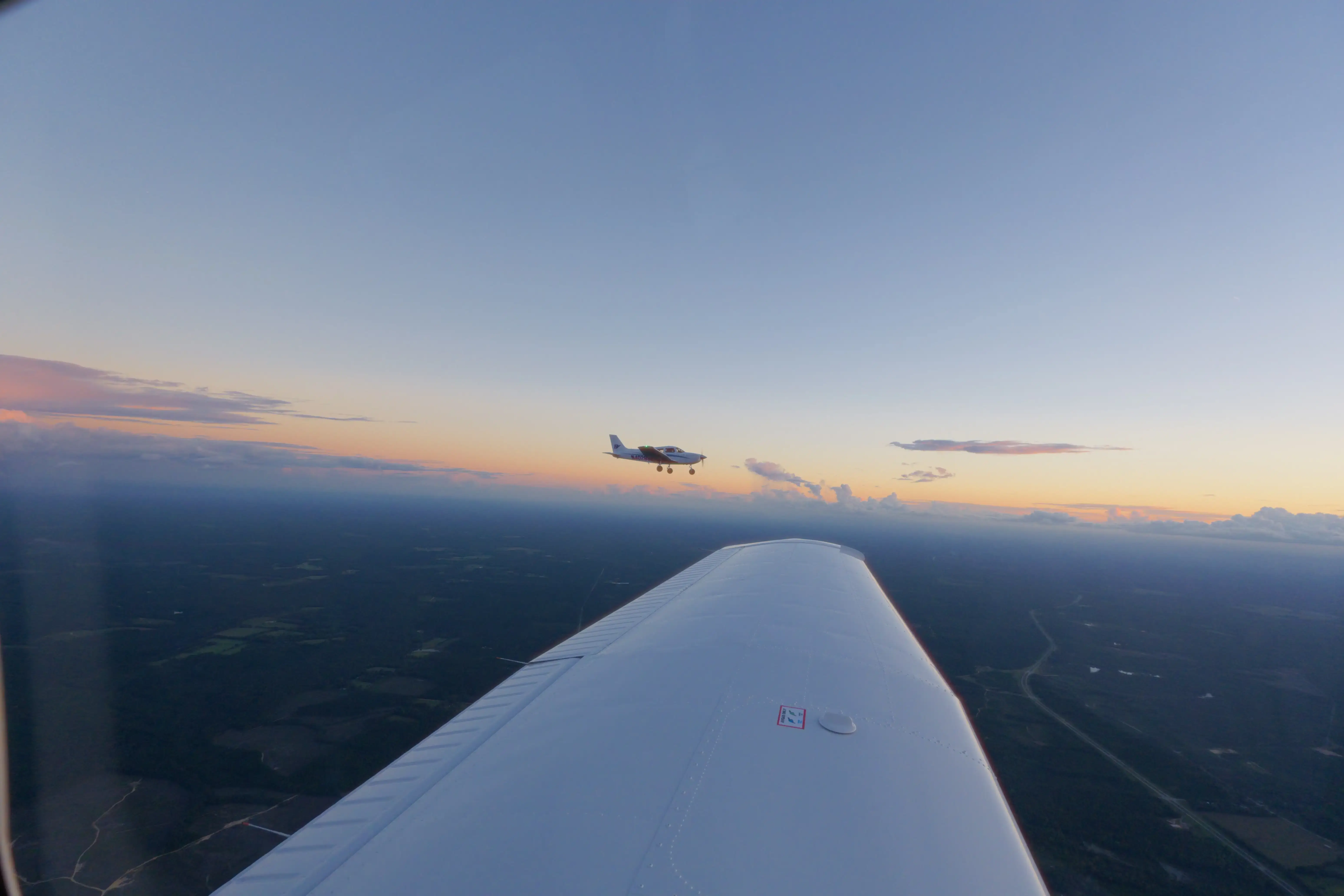 Blitz Aviation trainer aircraft flying in formation at twilight over Utah