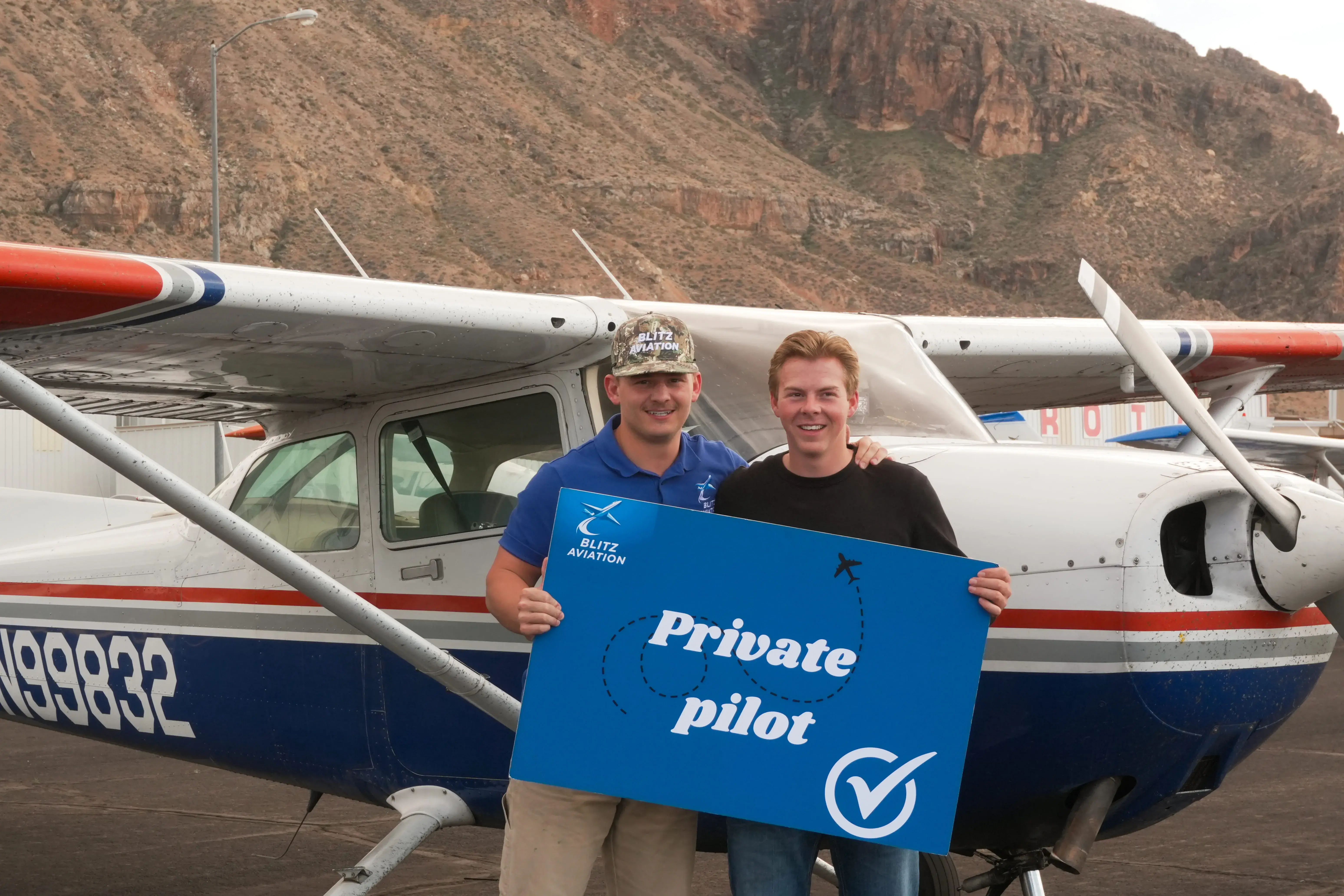 Student with CFII licence after a successful checkride in front of the aircraft.