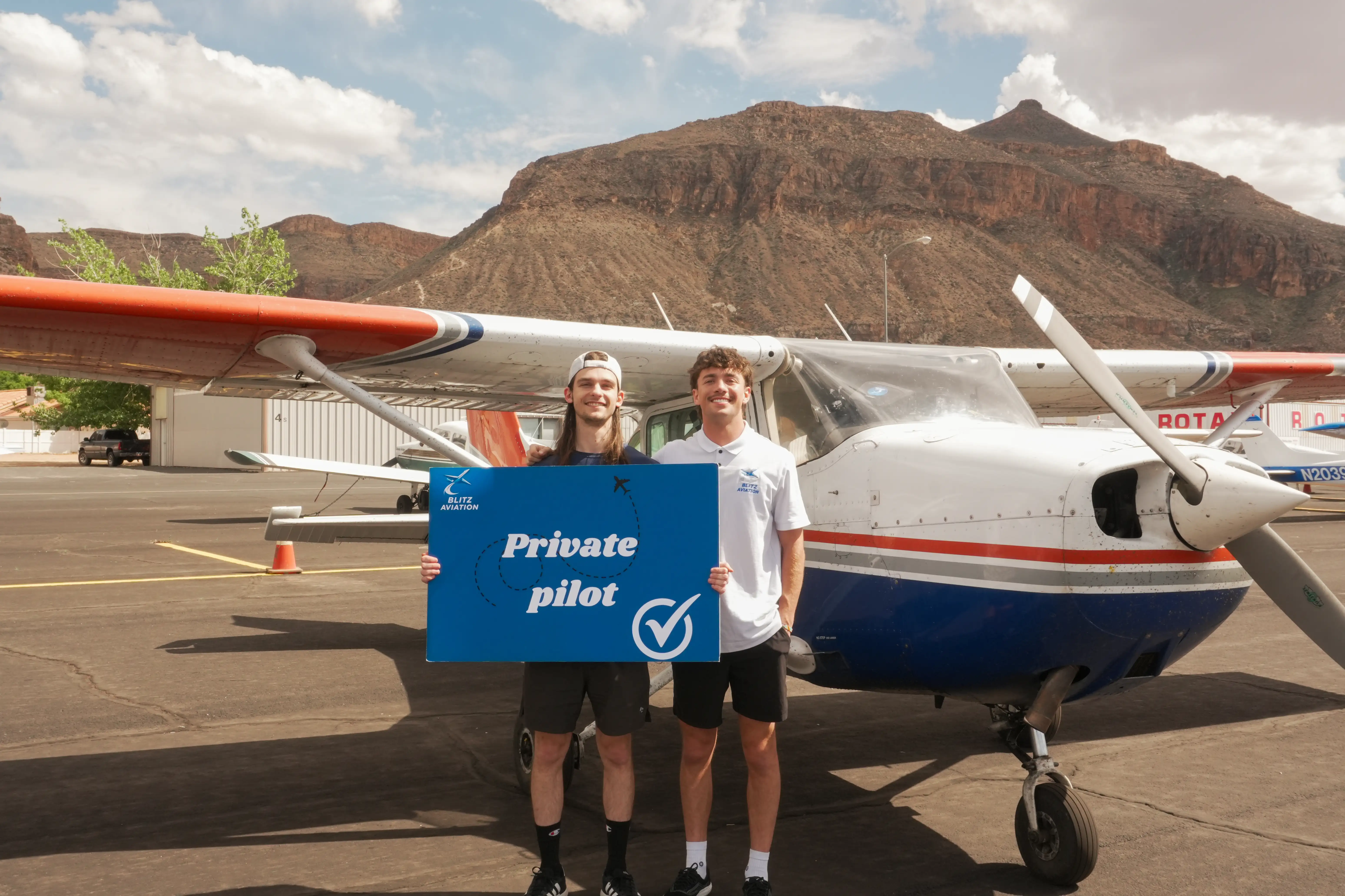 Student and CFI celebrating after a successful checkride. (Source: Blitz Aviation media archive)